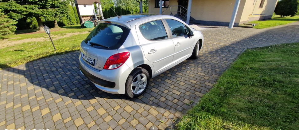 Peugeot 207 cena 16800 przebieg: 129107, rok produkcji 2010 z Bełchatów małe 407